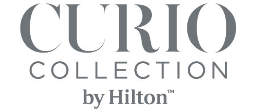 Curio Collection by Hilton logo on a black background. logo on footer section.